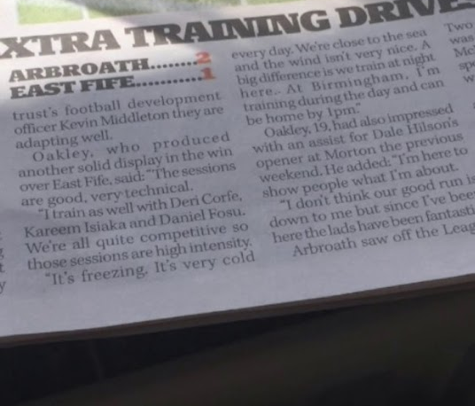 High intensity football training drill with players sprinting and competing